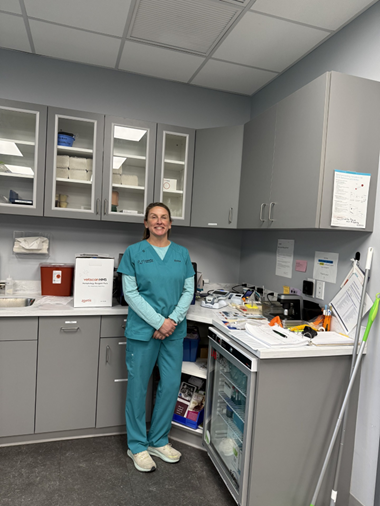 A vet stands in the lab of the vet office.